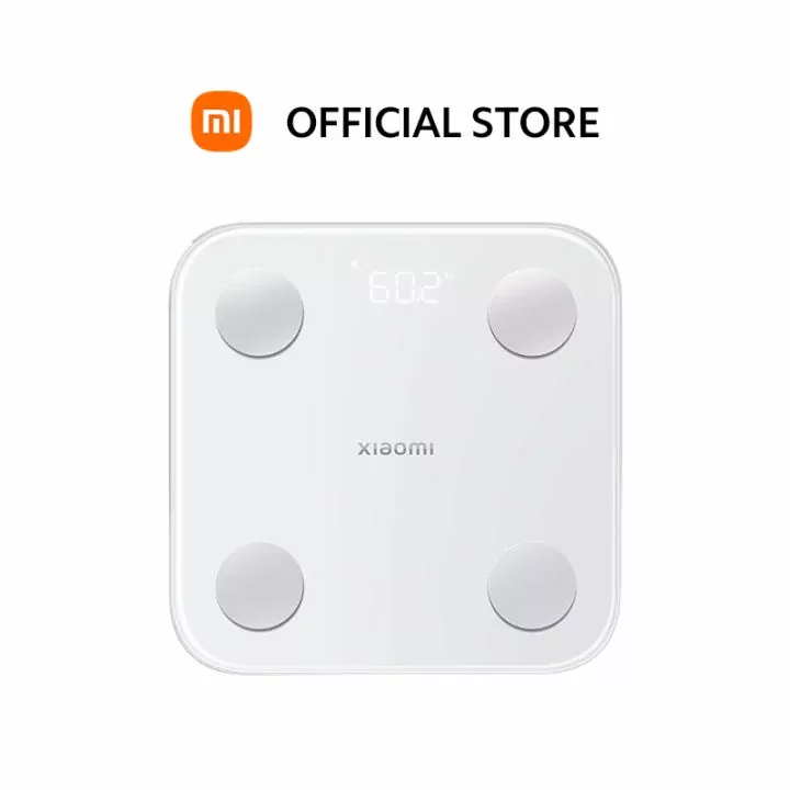 Xiaomi Body Composition Scale S400 showing weight and body composition metrics on its LED display.