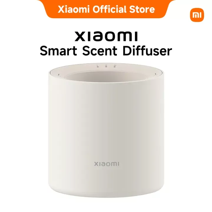 Xiaomi Smart Scent Diffuser on a table, a modern white device for home fragrance and aromatherapy.