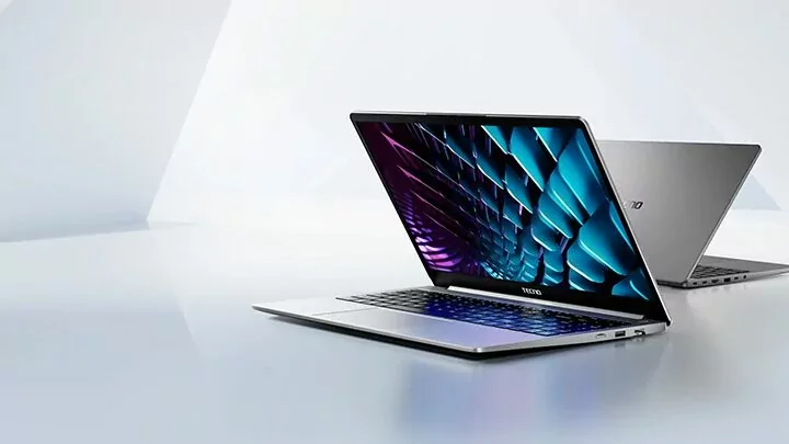 Tecno Megabook K15s laptop with a large display, keyboard, and trackpad visible.